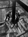 Workers balancing on steel beam above streets during construction of the Manhattan Company Building-Arthur Gerlach-Photographic Print