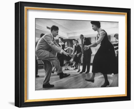 Arthur Murray and His Wife, While Giving a Rock 'N' Roll Demonstration-null-Framed Photographic Print