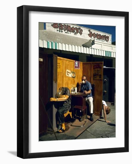 Artist Ed Kienholz Drinking Coffee Inside Section of His Assemblage "The Beanery. "-Ralph Crane-Framed Photographic Print