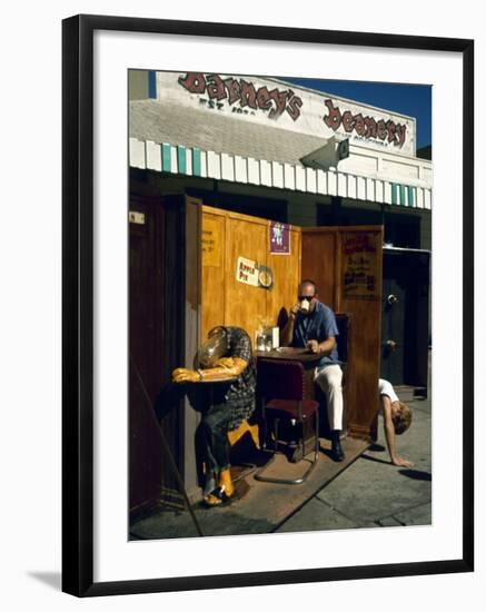 Artist Ed Kienholz Drinking Coffee Inside Section of His Assemblage "The Beanery. "-Ralph Crane-Framed Photographic Print