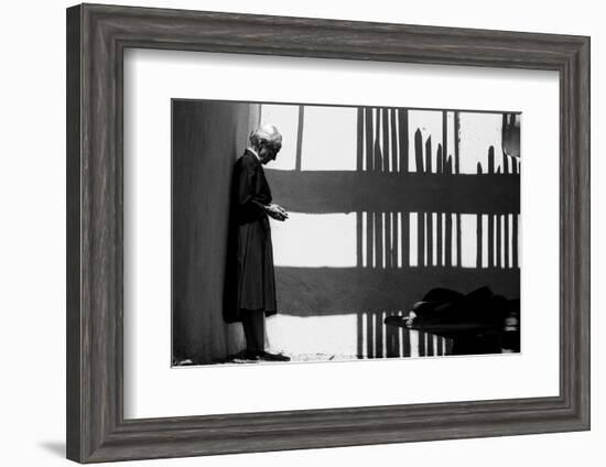 Artist Georgia O'Keeffe Against a Wall Amidst the Shadows of a Fence, Abiquiu, New Mexico, 1966-John Loengard-Framed Photographic Print