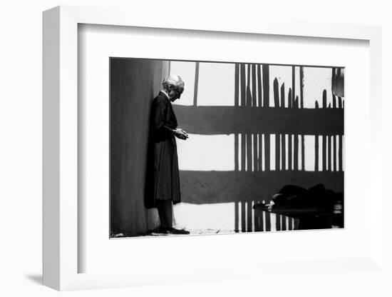 Artist Georgia O'Keeffe Against a Wall Amidst the Shadows of a Fence, Abiquiu, New Mexico, 1966-John Loengard-Framed Photographic Print