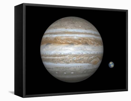 Artist's Concept Comparing the Size of the Gas Giant Jupiter with That of the Earth-Stocktrek Images-Framed Premier Image Canvas