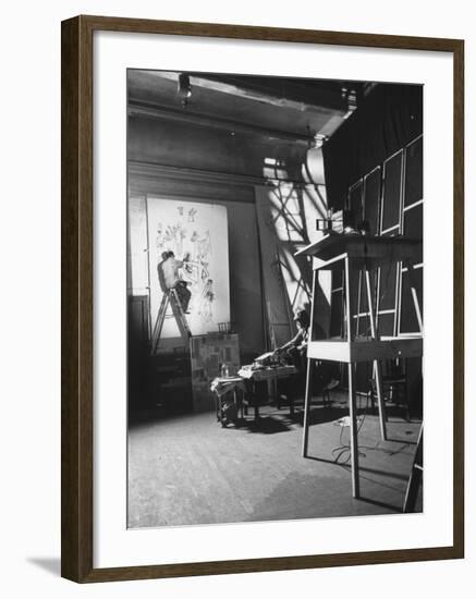 Artist Saul Steinberg at Work in Gjon Mili's Studio on Murals for Terrace Plaza Hotel in Cincinnati-Gjon Mili-Framed Premium Photographic Print