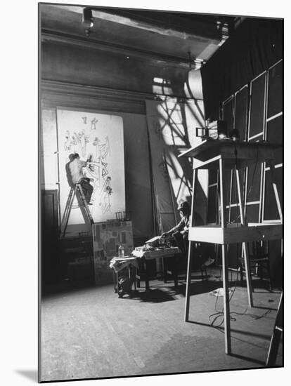 Artist Saul Steinberg at Work in Gjon Mili's Studio on Murals for Terrace Plaza Hotel in Cincinnati-Gjon Mili-Mounted Premium Photographic Print