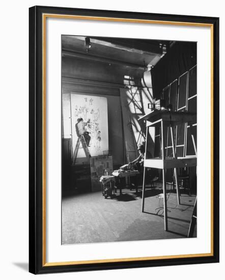 Artist Saul Steinberg at Work in Gjon Mili's Studio on Murals for Terrace Plaza Hotel in Cincinnati-Gjon Mili-Framed Premium Photographic Print