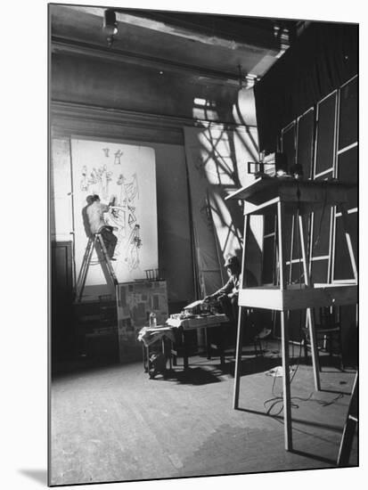 Artist Saul Steinberg at Work in Gjon Mili's Studio on Murals for Terrace Plaza Hotel in Cincinnati-Gjon Mili-Mounted Premium Photographic Print