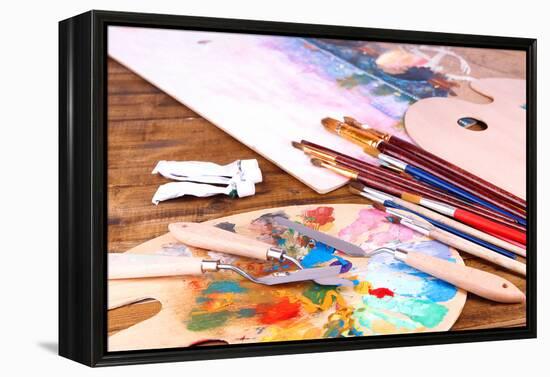 Artistic Equipment: Paint, Brushes and Art Palette on Wooden Table-Yastremska-Framed Stretched Canvas