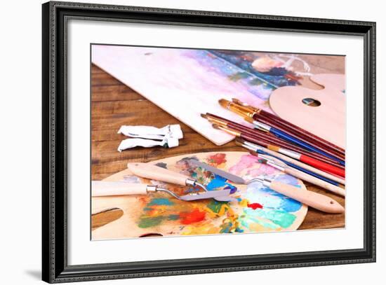 Artistic Equipment: Paint, Brushes and Art Palette on Wooden Table-Yastremska-Framed Art Print