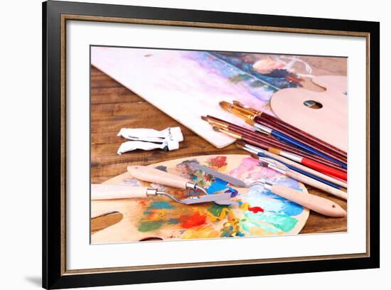 Artistic Equipment: Paint, Brushes and Art Palette on Wooden Table-Yastremska-Framed Art Print