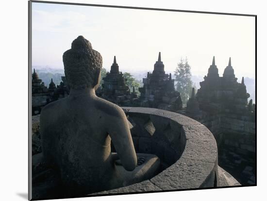 Arupadhatu Buddha, 8th Century Buddhist Site of Borobudur, Unesco World Heritage Site, Indonesia-Bruno Barbier-Mounted Photographic Print