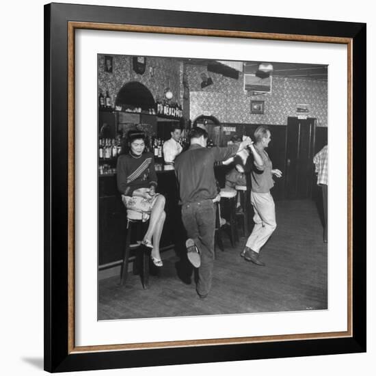 As the Communists Approach, Chinese Hostess Waits While American Seamen Cut Up in the Lear Bar-null-Framed Photographic Print