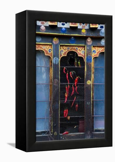 Asia, Bhutan, Haa Valley, Chili Peppers. Chili Peppers Drying in Windows-Ellen Goff-Framed Premier Image Canvas