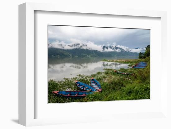 Asia, Nepal, Pokhara. Boats in the water lilies on Phewa Lake.-Janell Davidson-Framed Photographic Print