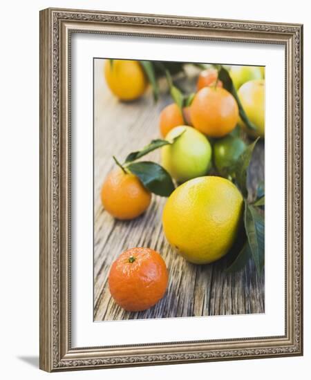 Assorted Citrus Fruit on Wooden Background-null-Framed Photographic Print