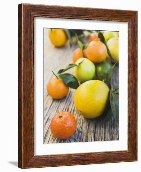 Assorted Citrus Fruit on Wooden Background-null-Framed Photographic Print