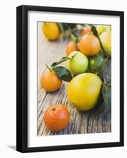 Assorted Citrus Fruit on Wooden Background-null-Framed Photographic Print