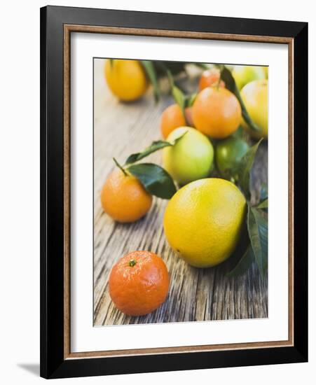 Assorted Citrus Fruit on Wooden Background-null-Framed Photographic Print