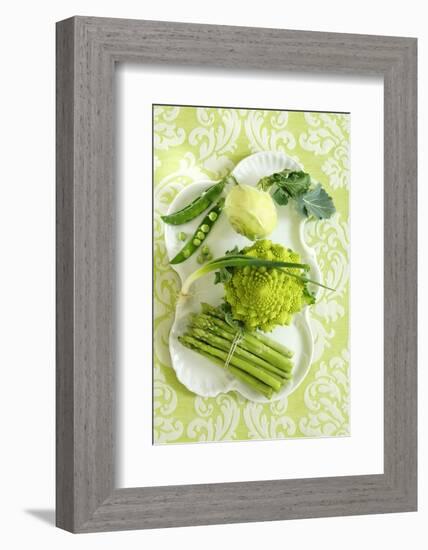 Assorted Green Vegetables on Porcelain Plate-Ulrike Koeb-Framed Photographic Print