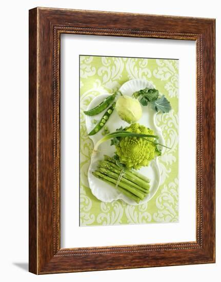 Assorted Green Vegetables on Porcelain Plate-Ulrike Koeb-Framed Photographic Print