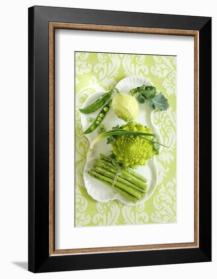 Assorted Green Vegetables on Porcelain Plate-Ulrike Koeb-Framed Photographic Print