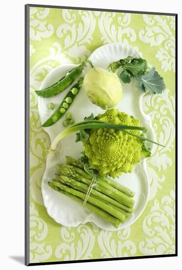 Assorted Green Vegetables on Porcelain Plate-Ulrike Koeb-Mounted Photographic Print