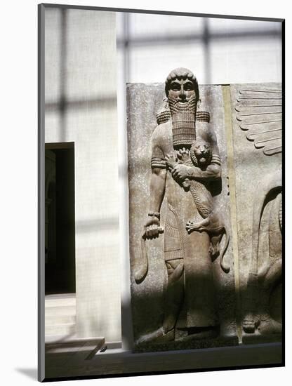 Assyrian sculpture of a man holding a lion, Khorsabad, c8th century BC. Artist: Unknown-Unknown-Mounted Giclee Print