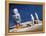 Astronaut Figurines Standing Beside Gray Toy Rocket-null-Framed Premier Image Canvas