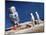 Astronaut Figurines Standing Beside Gray Toy Rocket-null-Mounted Photographic Print