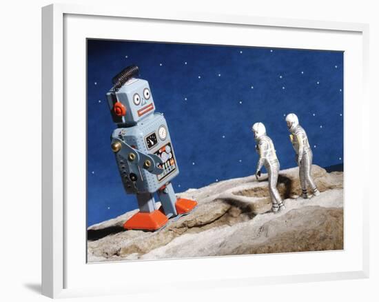 Astronaut Figurines Standing Beside Gray Toy Rocket--Framed Photographic Print