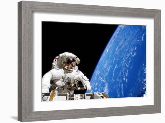 Astronaut Performing a Spacewalk-null-Framed Photographic Print