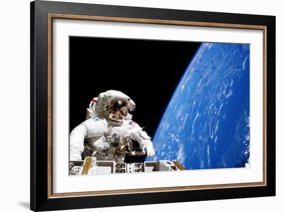 Astronaut Performing a Spacewalk-null-Framed Photographic Print