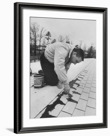 Astronaut Virgil I. Grissom Using Roof Cement at Home-Ralph Morse-Framed Premium Photographic Print