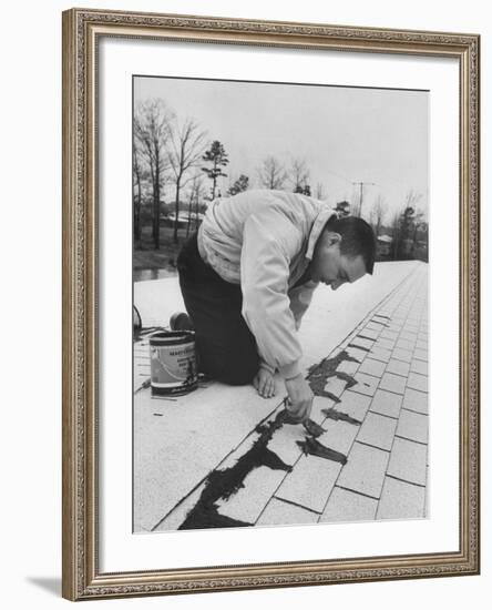 Astronaut Virgil I. Grissom Using Roof Cement at Home-Ralph Morse-Framed Premium Photographic Print