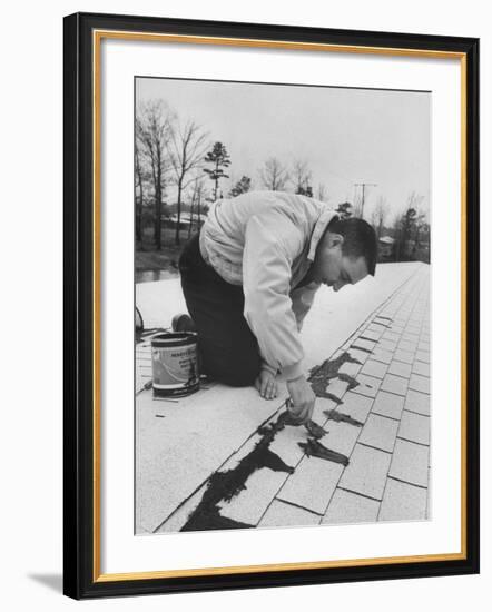 Astronaut Virgil I. Grissom Using Roof Cement at Home-Ralph Morse-Framed Premium Photographic Print