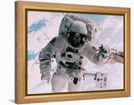 Astronaut Walking in Space-David Bases-Framed Premier Image Canvas