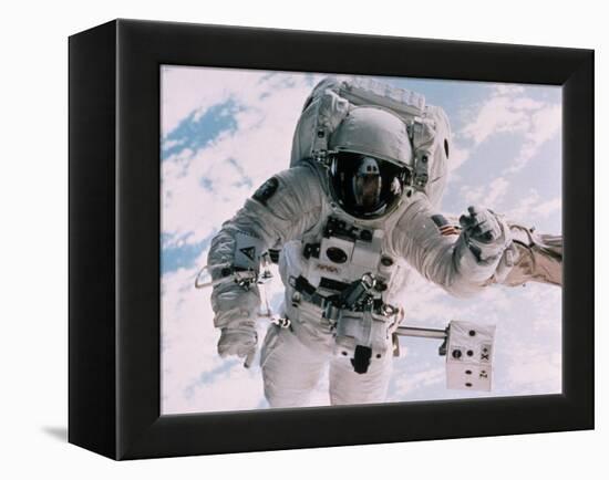 Astronaut Walking in Space-David Bases-Framed Premier Image Canvas