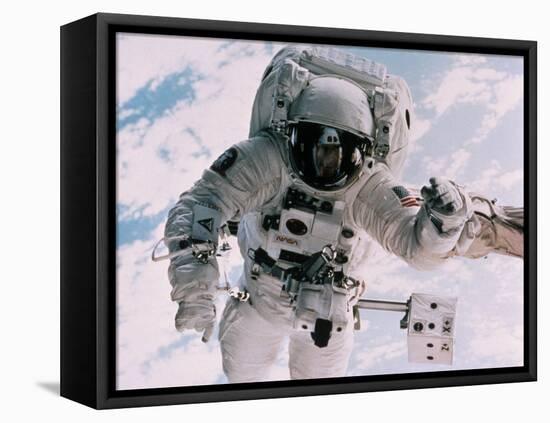 Astronaut Walking in Space-David Bases-Framed Premier Image Canvas