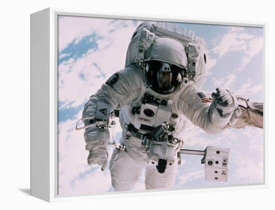 Astronaut Walking in Space-David Bases-Framed Premier Image Canvas