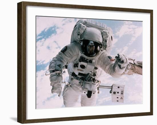 Astronaut Walking in Space-David Bases-Framed Photographic Print