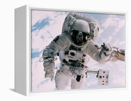 Astronaut Walking in Space-David Bases-Framed Premier Image Canvas
