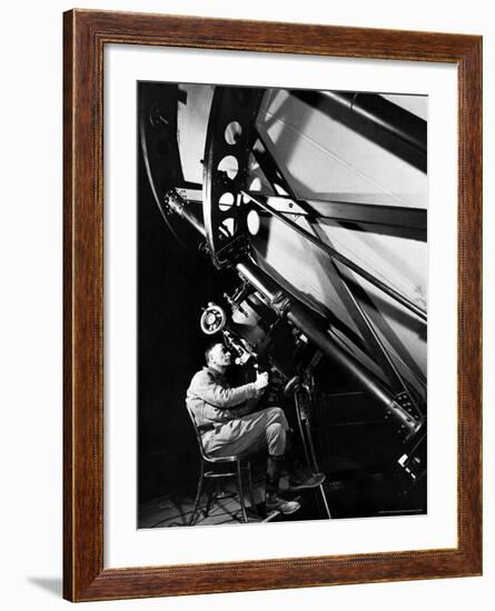 Astronomer Edwin Powell Hubble Looking Though Eyepiece of Telescope at Mt. Wilson Observatory-Margaret Bourke-White-Framed Premium Photographic Print