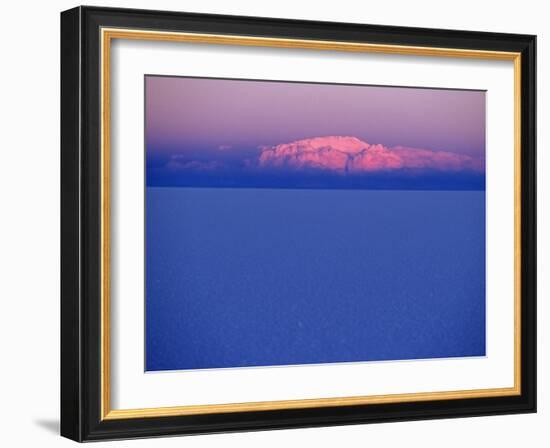 At Sunset a Cloud Is Painted Pink by the Last Rays of the Sun over the Salar De Uyuni, the Largest -John Warburton-lee-Framed Photographic Print