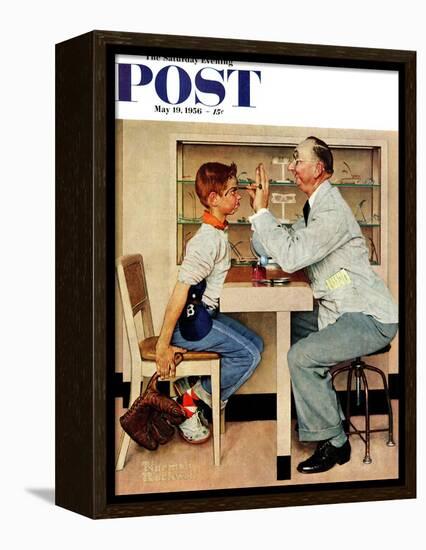 "At the Optometrist" or "Eye Doctor" Saturday Evening Post Cover, May 19,1956-Norman Rockwell-Framed Premier Image Canvas