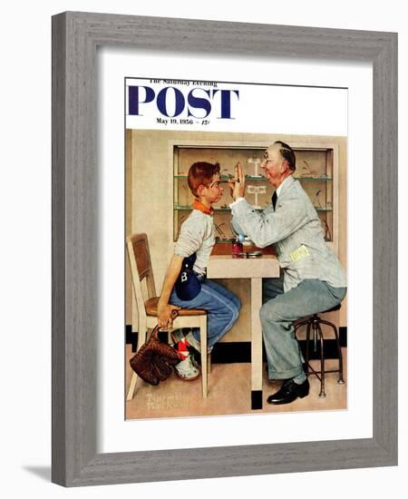 "At the Optometrist" or "Eye Doctor" Saturday Evening Post Cover, May 19,1956-Norman Rockwell-Framed Giclee Print