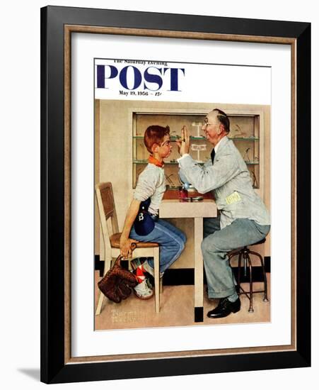 "At the Optometrist" or "Eye Doctor" Saturday Evening Post Cover, May 19,1956-Norman Rockwell-Framed Giclee Print