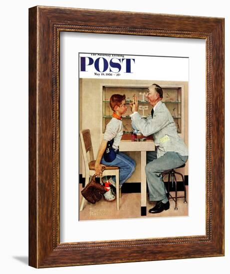 "At the Optometrist" or "Eye Doctor" Saturday Evening Post Cover, May 19,1956-Norman Rockwell-Framed Giclee Print