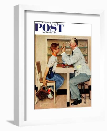"At the Optometrist" or "Eye Doctor" Saturday Evening Post Cover, May 19,1956-Norman Rockwell-Framed Giclee Print