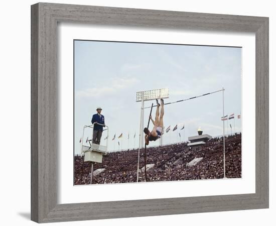 Athlete Clearing the Pole Vault at Summer Olympics-John Dominis-Framed Photographic Print