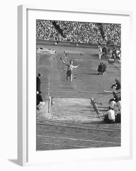 Athlete Competing in Long Jump-null-Framed Premium Photographic Print